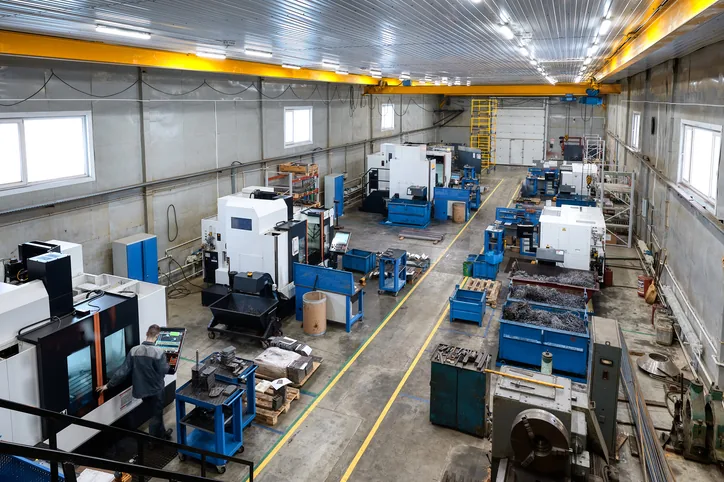 Precision machine shop floor with CNC equipment